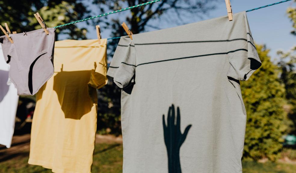 Clothes drying on rope with clothespins in garden Clothes drying on rope with clothespins in garden
