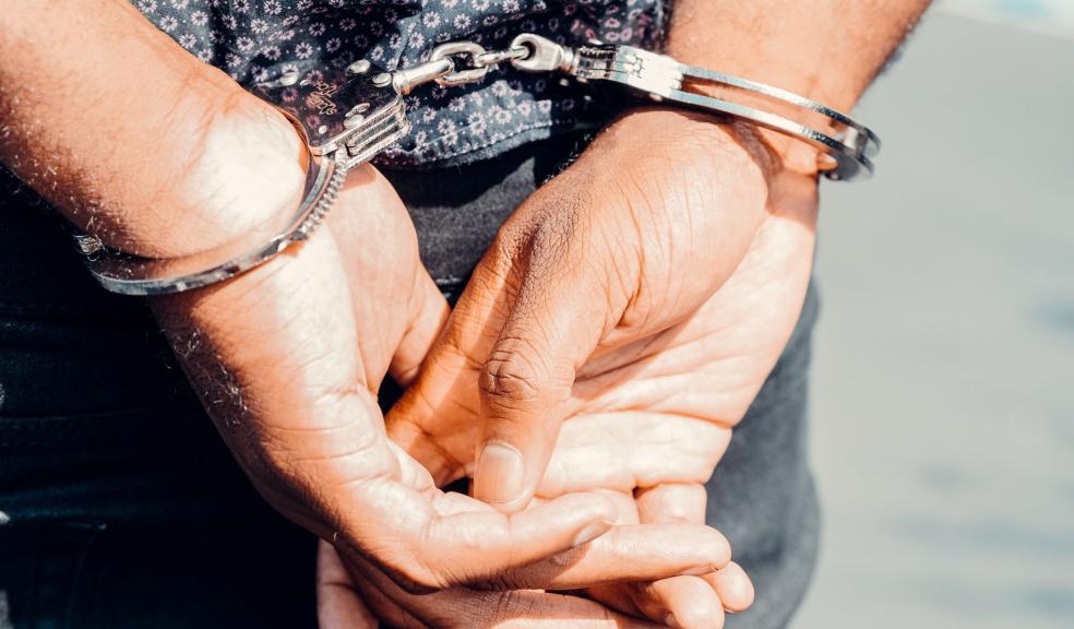Close Up Photography of Person in Handcuffs Close Up Photography of Person in Handcuffs